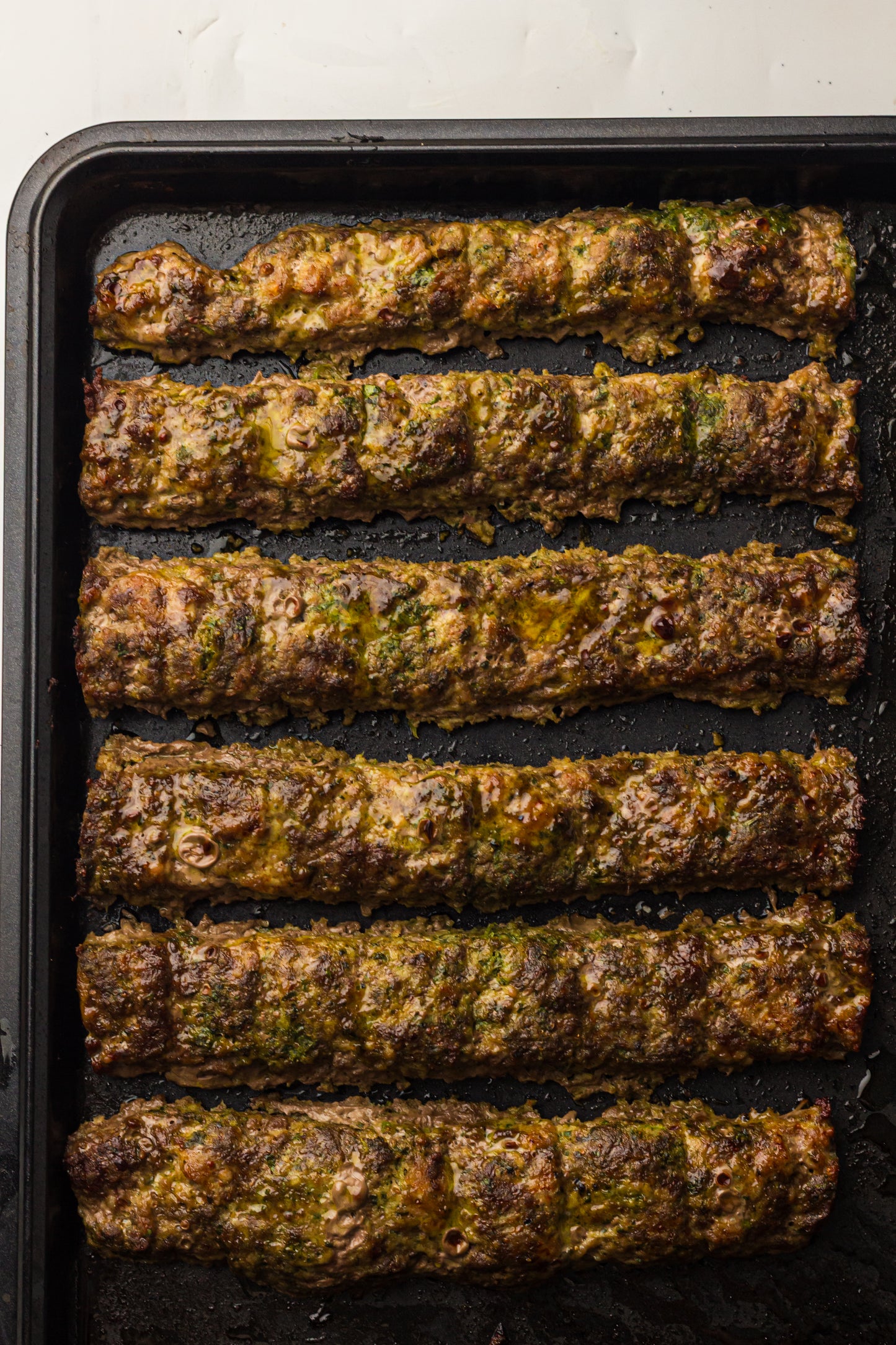 Sheet Pan Koftas with Tahini Dressing & Sumac Tomato-Cucumber Salad