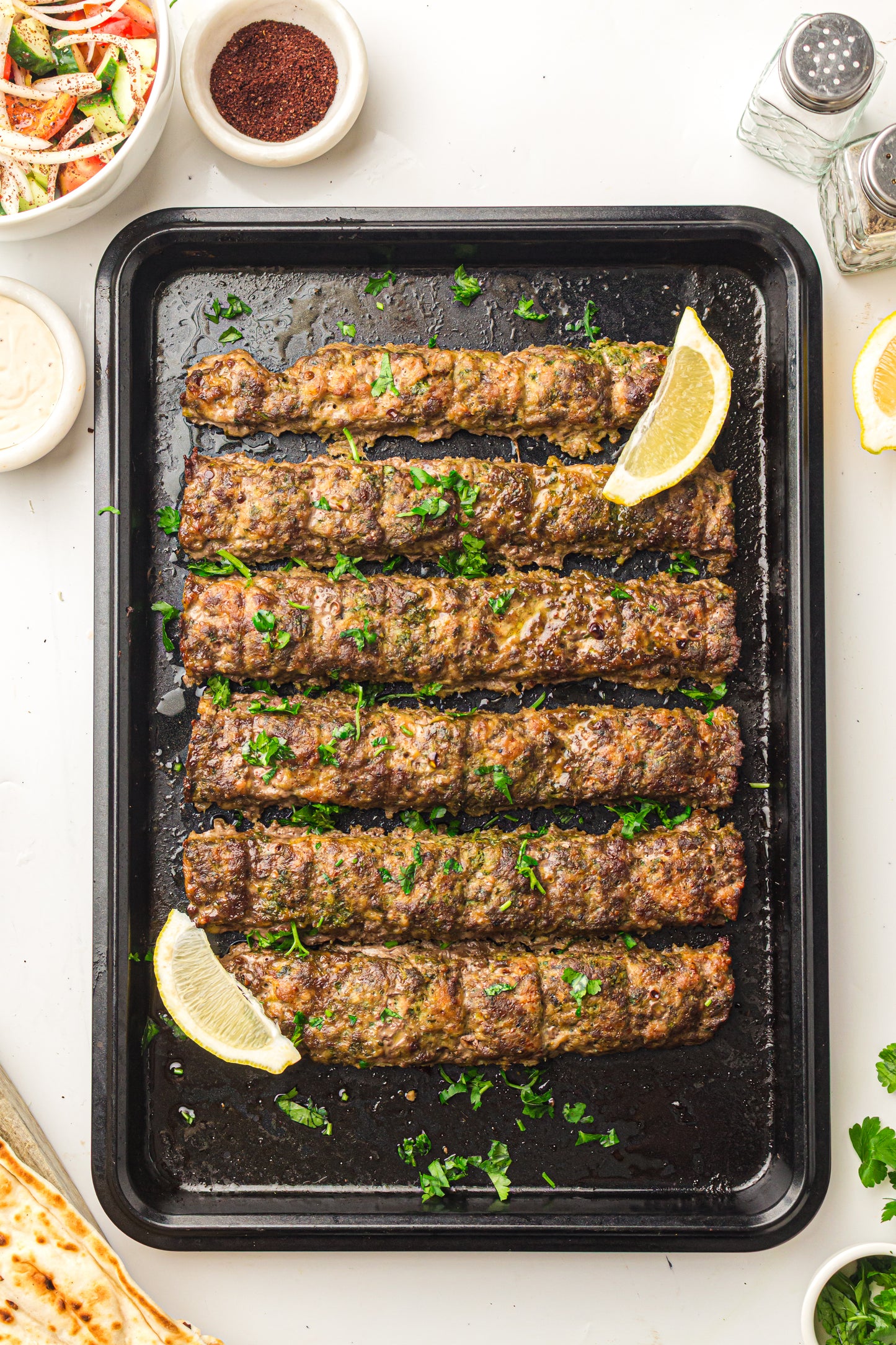 Sheet Pan Koftas with Tahini Dressing & Sumac Tomato-Cucumber Salad