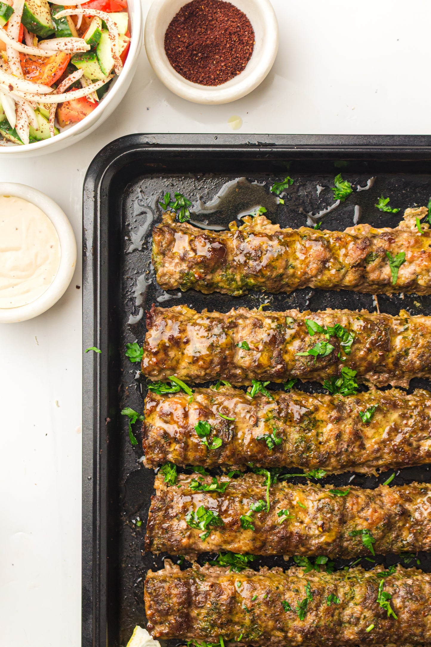 Sheet Pan Koftas with Tahini Dressing & Sumac Tomato-Cucumber Salad