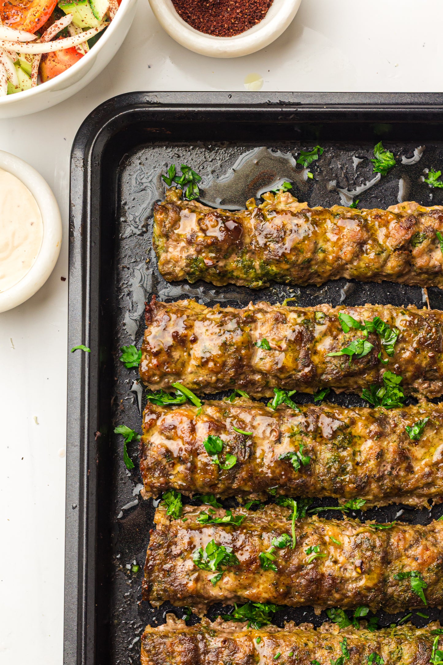 Sheet Pan Koftas with Tahini Dressing & Sumac Tomato-Cucumber Salad