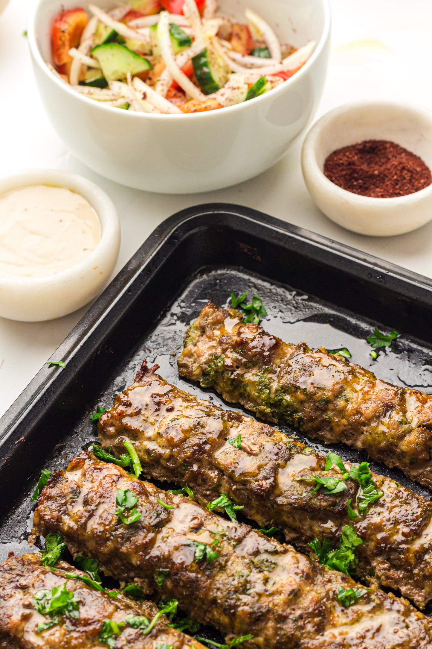Sheet Pan Koftas with Tahini Dressing & Sumac Tomato-Cucumber Salad