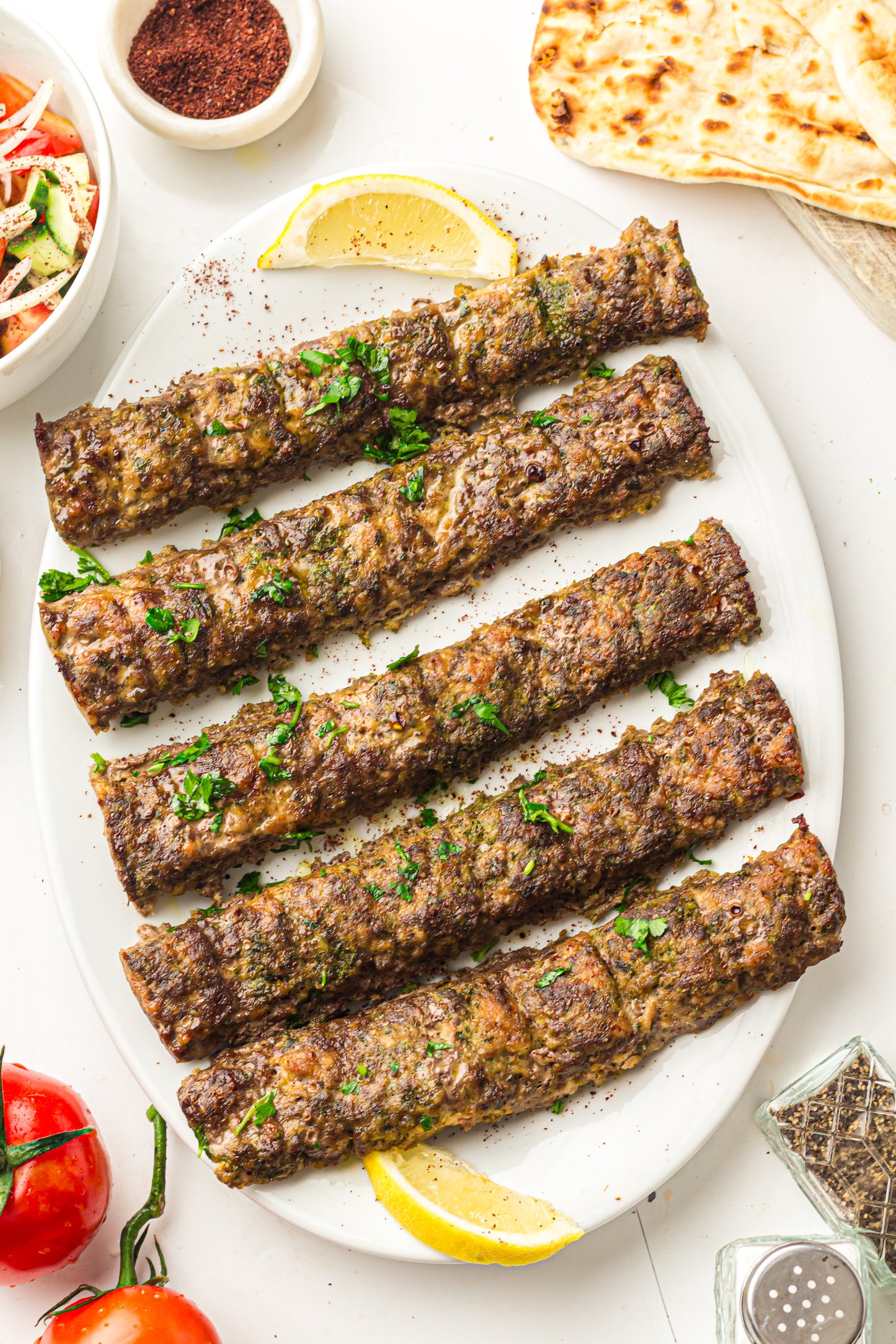 Sheet Pan Koftas with Tahini Dressing & Sumac Tomato-Cucumber Salad