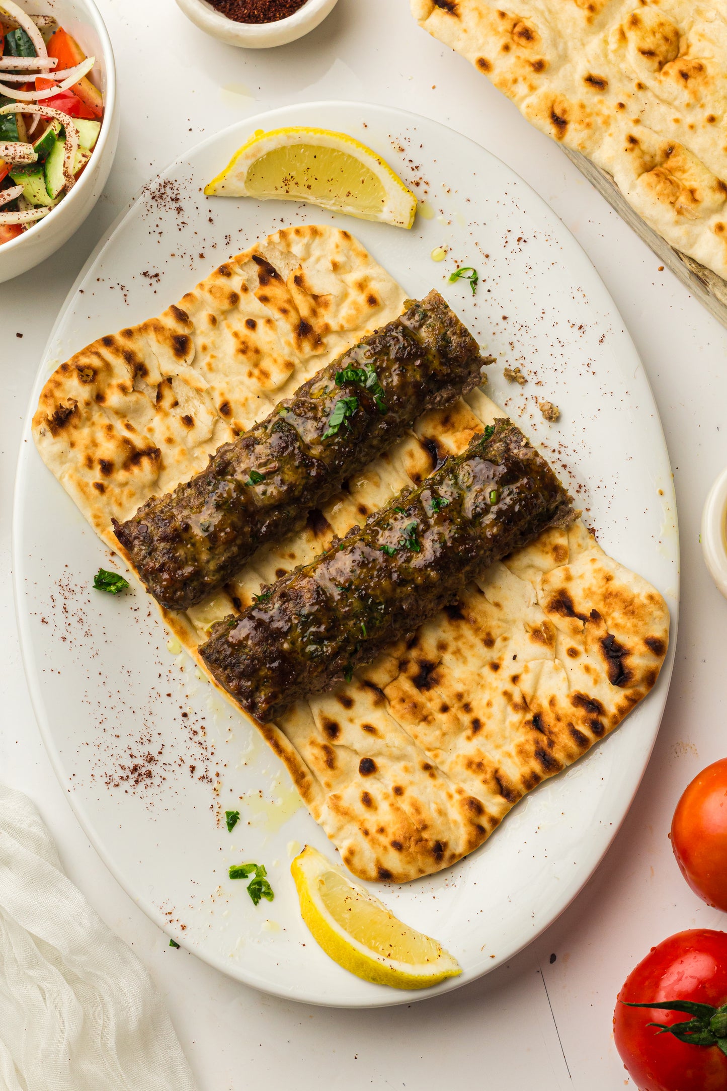 Sheet Pan Koftas with Tahini Dressing & Sumac Tomato-Cucumber Salad