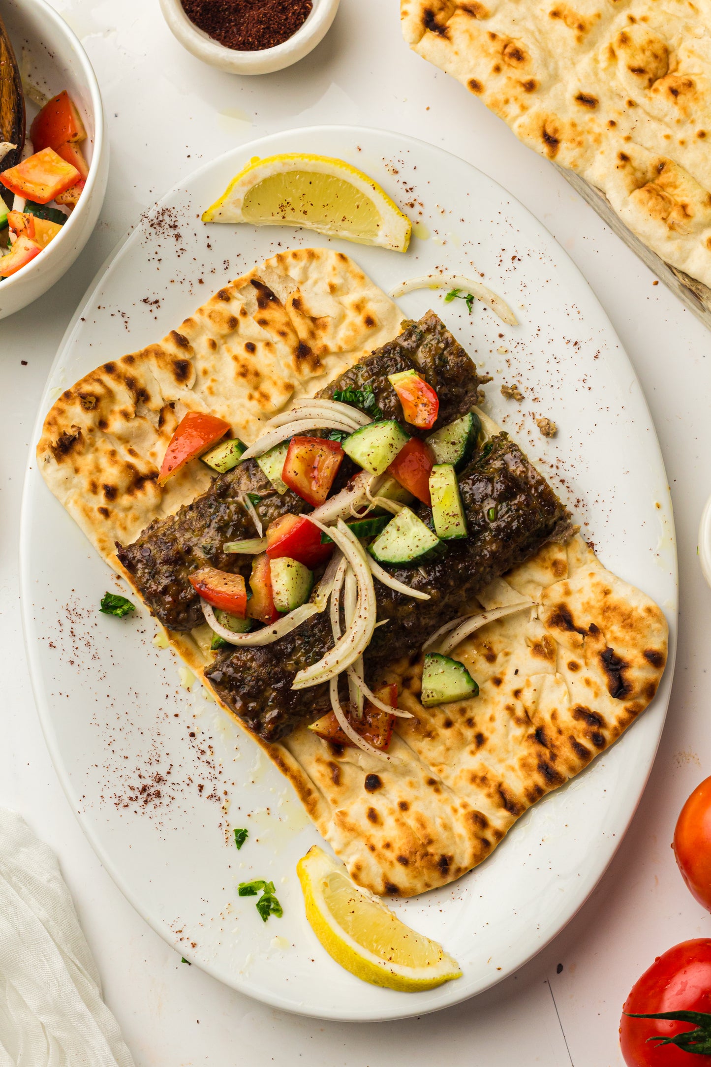 Sheet Pan Koftas with Tahini Dressing & Sumac Tomato-Cucumber Salad