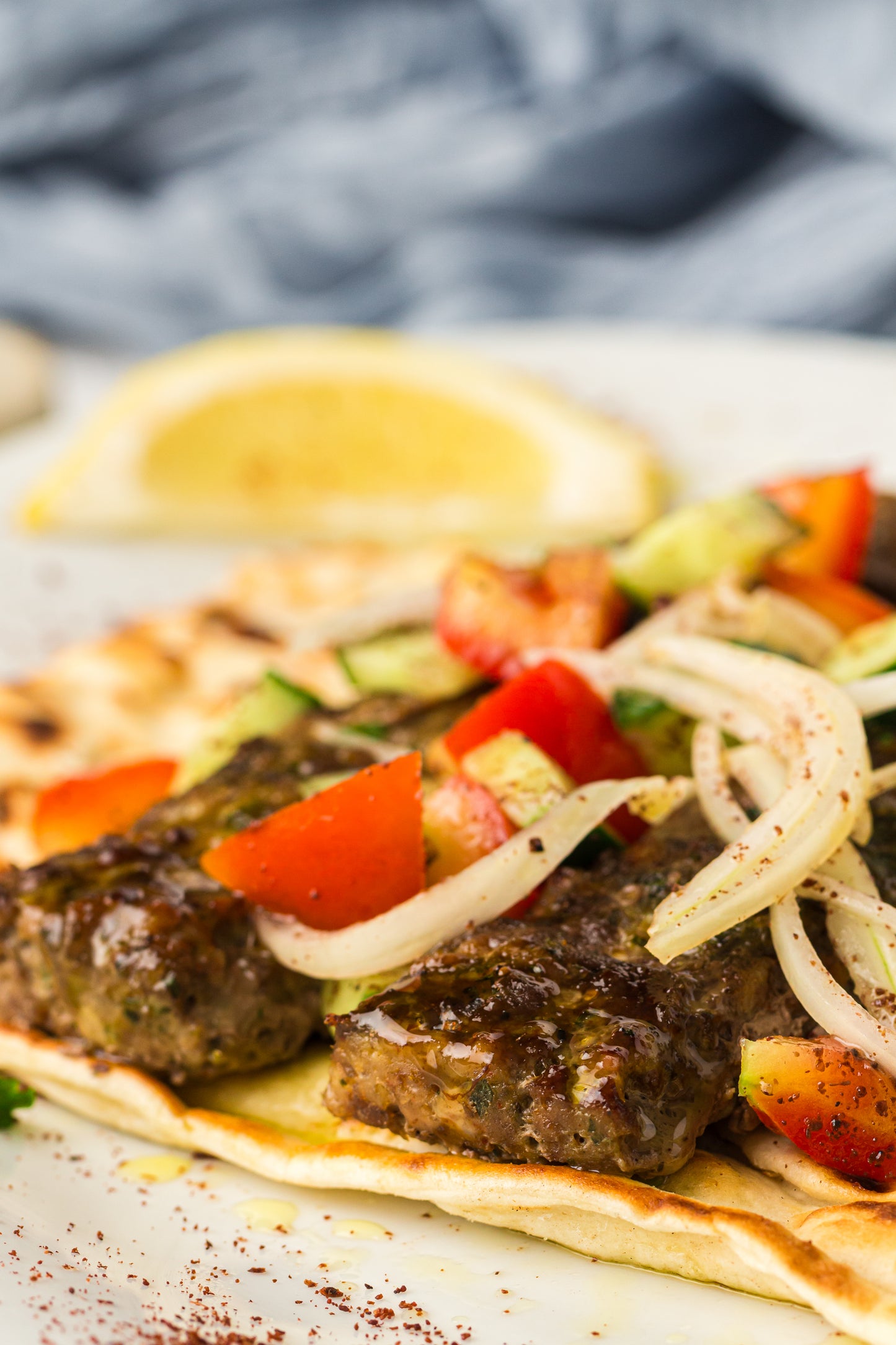 Sheet Pan Koftas with Tahini Dressing & Sumac Tomato-Cucumber Salad