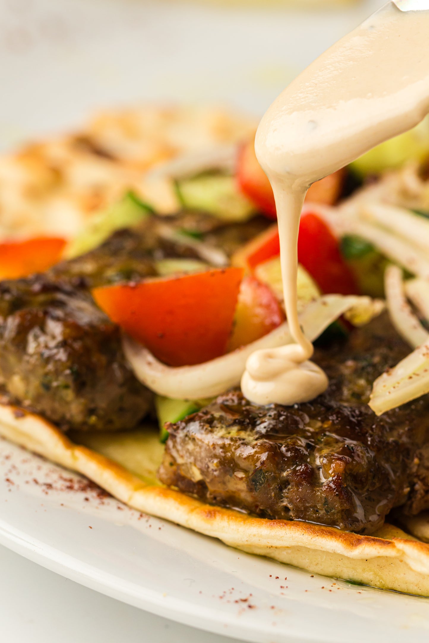 Sheet Pan Koftas with Tahini Dressing & Sumac Tomato-Cucumber Salad