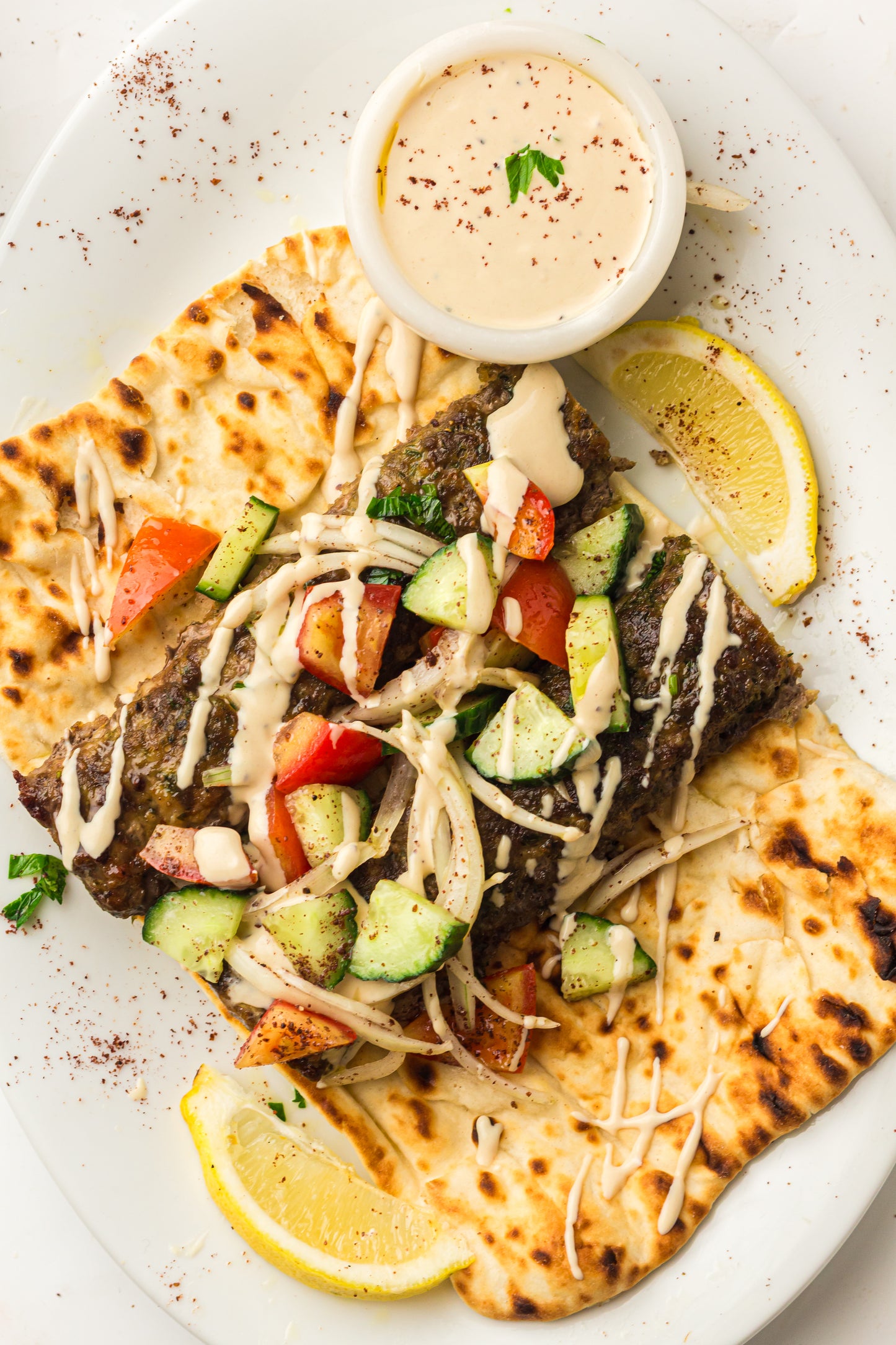 Sheet Pan Koftas with Tahini Dressing & Sumac Tomato-Cucumber Salad